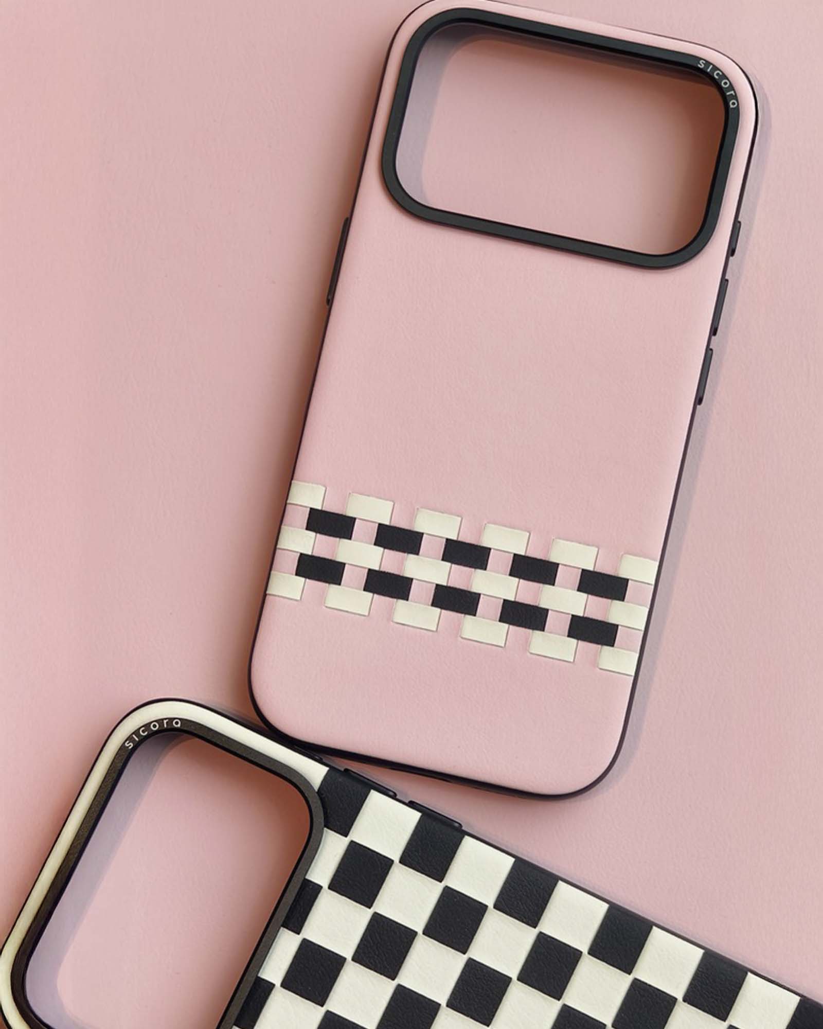 Two sicora handmade phone cases with geometric pattern on a pink background