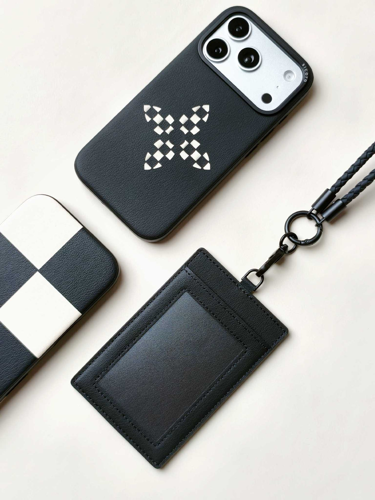 sicora vegan leather ID badge holder lanyard set in black, with matching sicora vegan leather iPhone 18 / 17 pro cases, bloom case and macro case