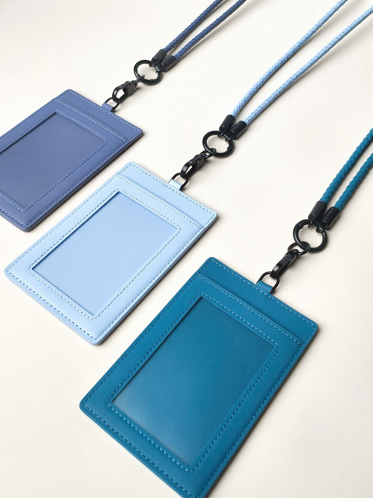 Three sicora vegan leather ID badge holder lanyard set in shadow blue, sky blue, and sea blue