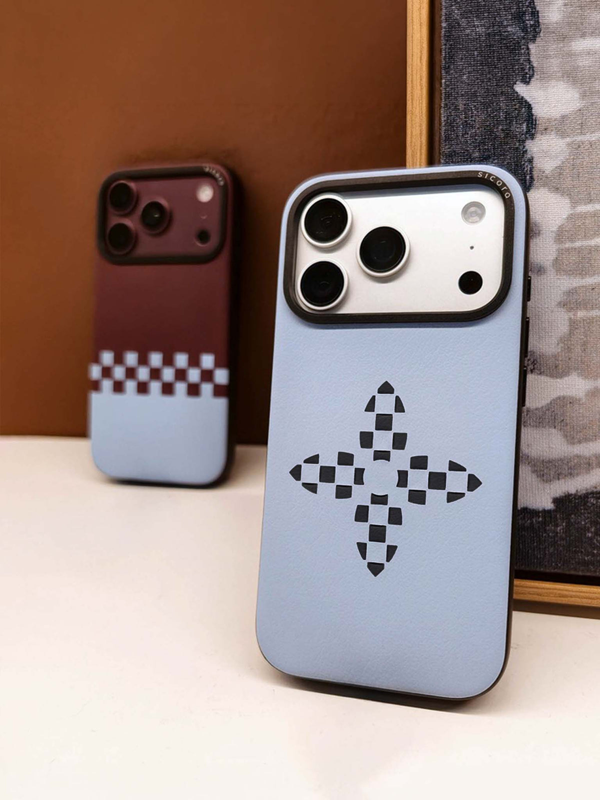 Two sicora iPhone 18 / 17 pro vegan leather cases, sky blue bloom case and cherry sky crossover case.