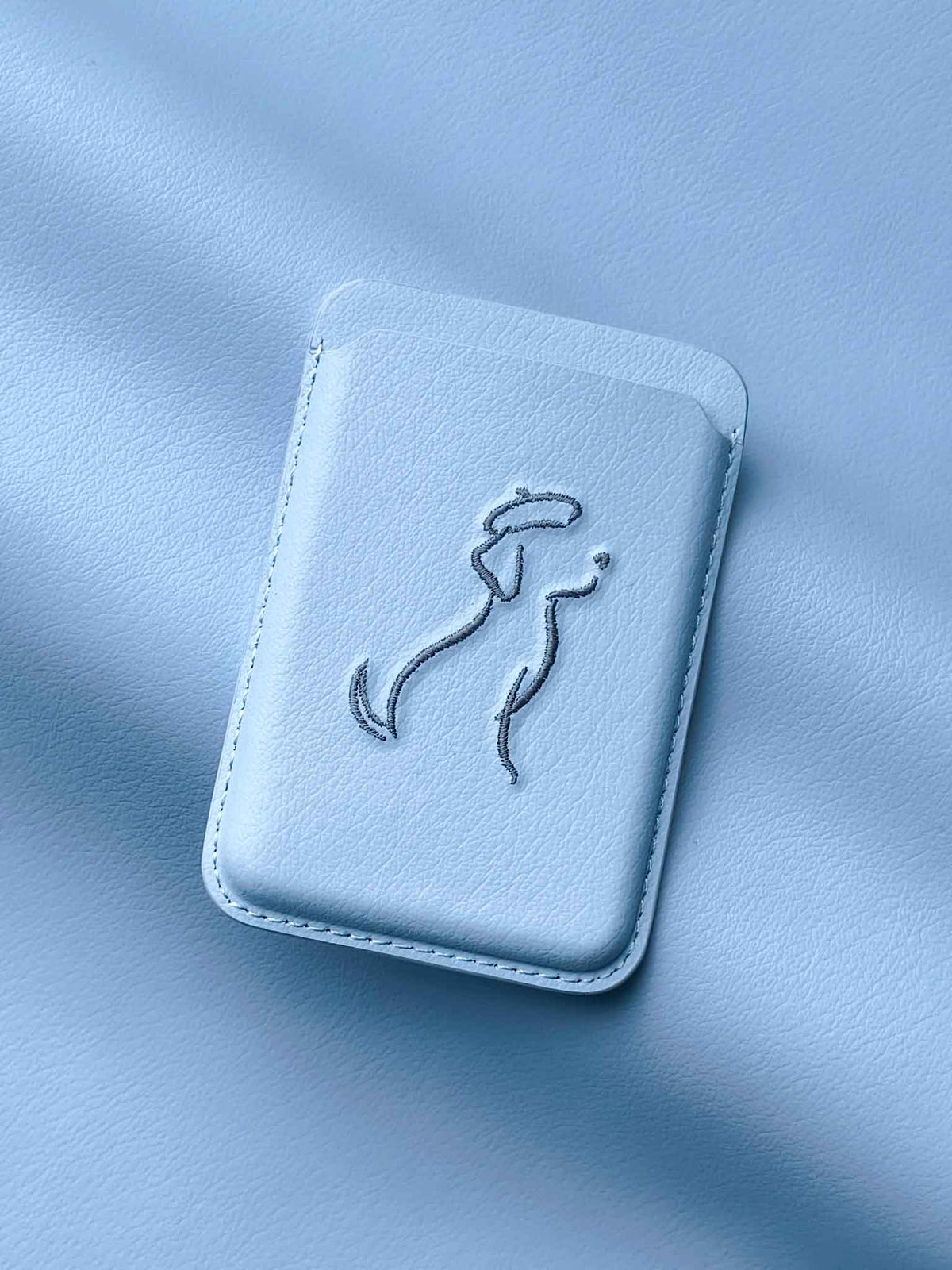 sicora vegan leather graphic magnetic card wallet in sky blue with grey blue embroidered dog line-drawing,