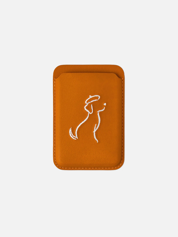 sicora vegan leather graphic magnetic card wallet in toffee gold brown with cream white embroidered dog line-drawing, front view