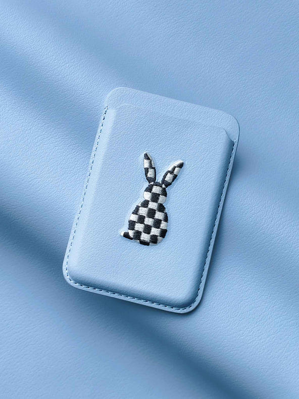 sicora vegan leather graphic magnetic card wallet in light blue with black and white embroidered rabbit artwork