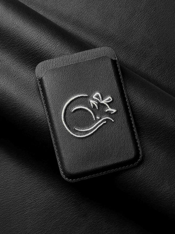 sicora vegan leather graphic magnetic card wallet in black with cream white embroidered cat line-drawing