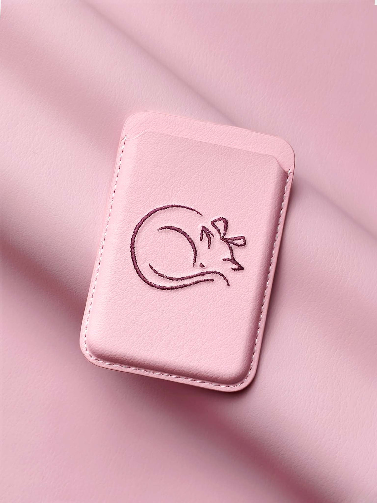 sicora vegan leather graphic magnetic card wallet in pink with dark burgundy embroidered cat line-drawing