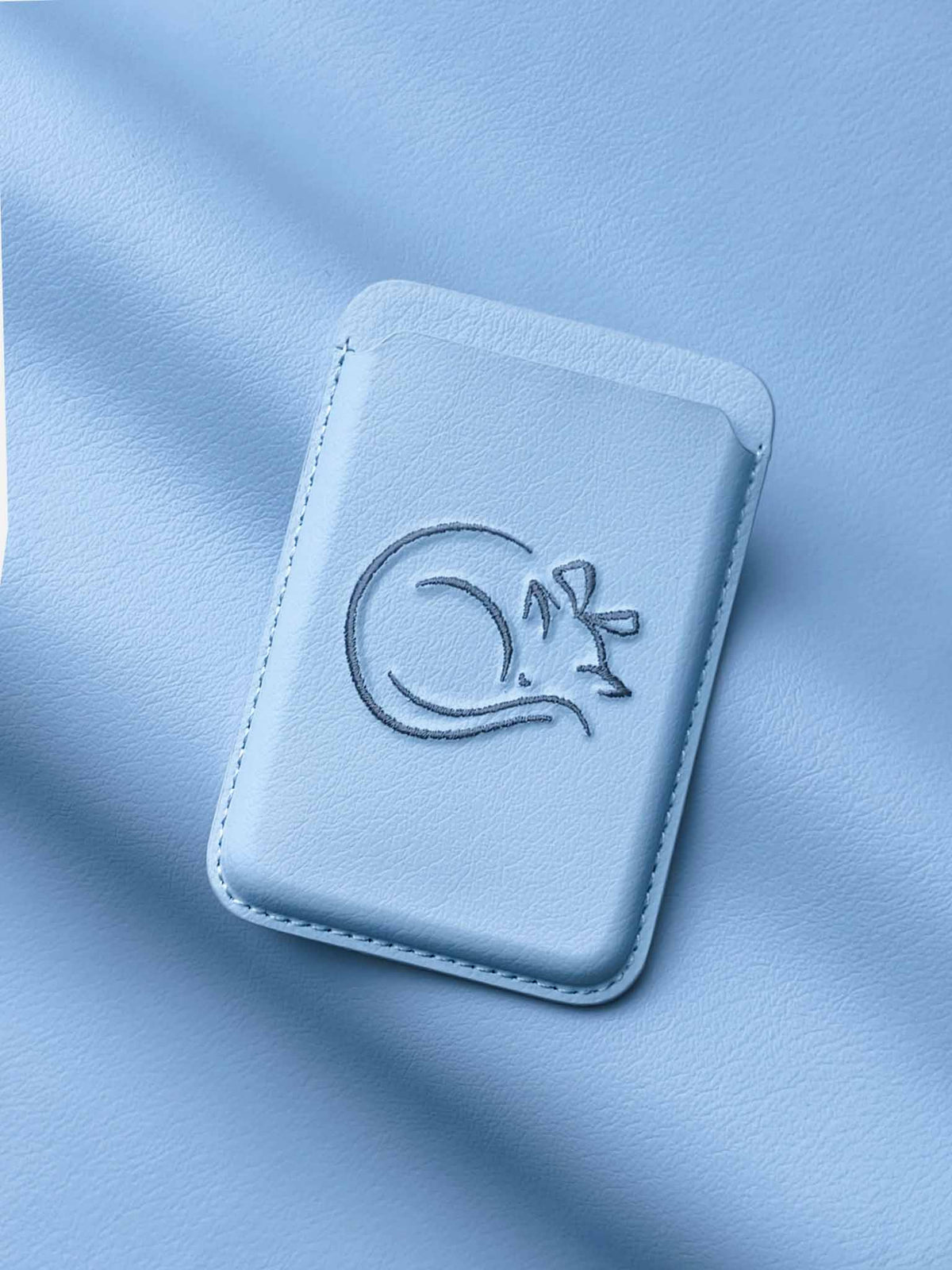 sicora vegan leather graphic magnetic card wallet in sky blue with grey blue embroidered cat line-drawing
