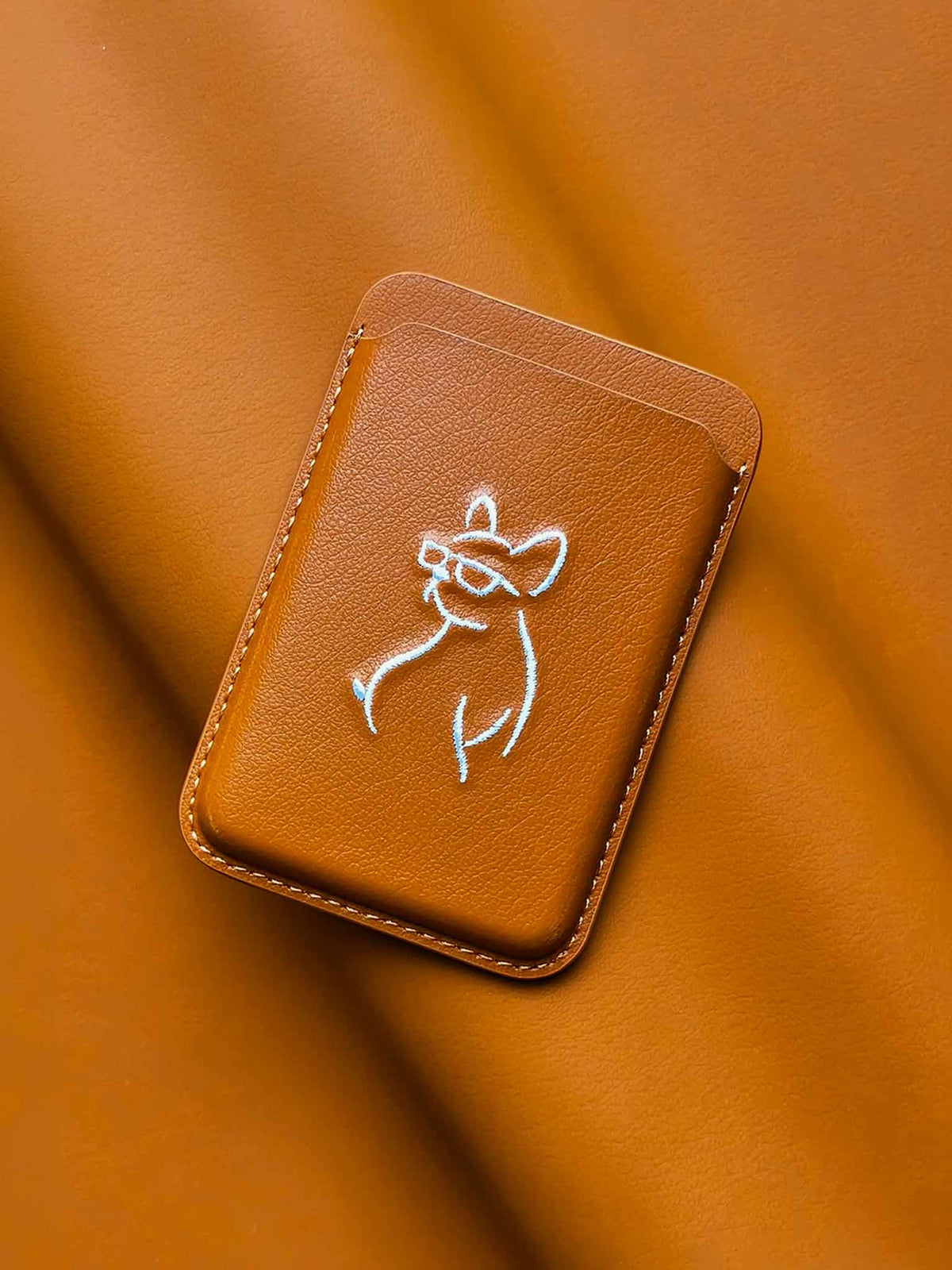 sicora vegan leather graphic magnetic card wallet in toffee gold brown with cream white embroidered dog line-drawing