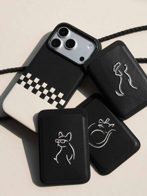 Flat-lays of black sicora vegan leather accessories: iPhone 18 / 17 pro case, magnetic card wallets, and lanyard