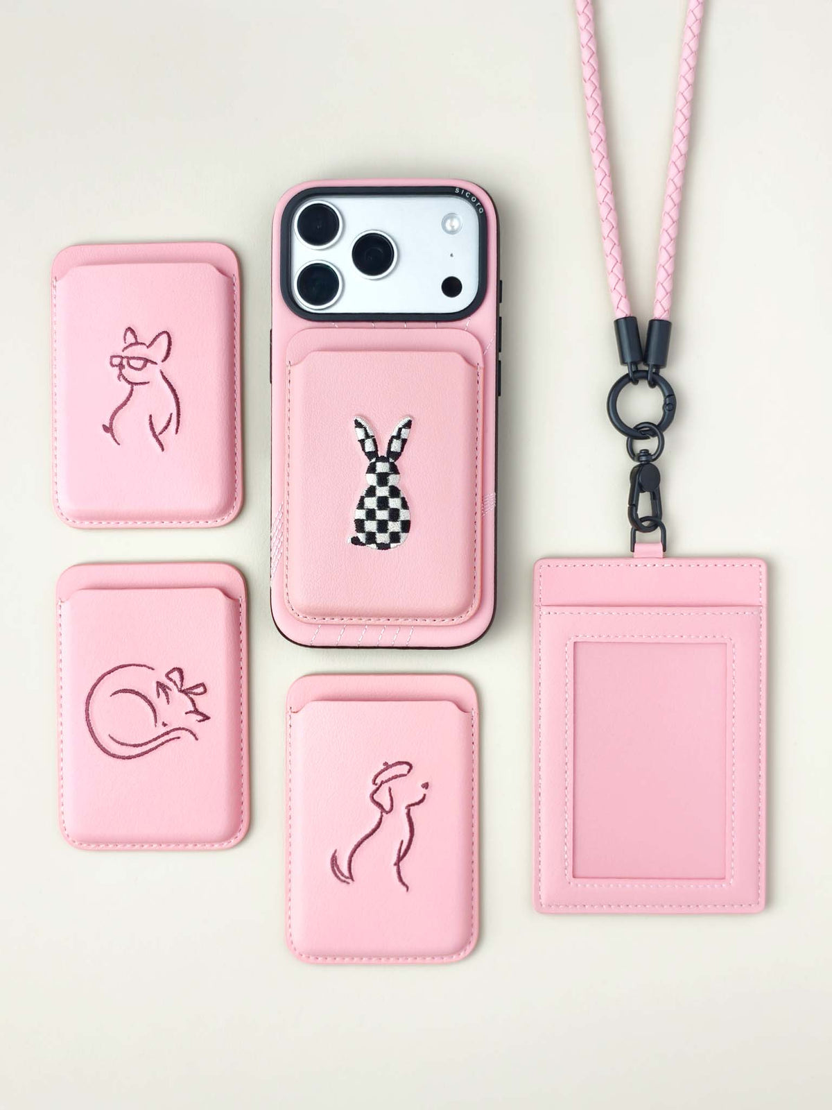 Flat-lays of pink sicora vegan leather accessories: iPhone 18 / 17 pro case, magnetic card wallets, and ID badge holder with lanyard