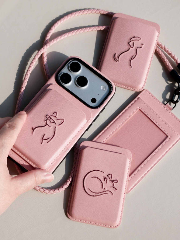 Product shot of pink sicora vegan leather accessories: iPhone 18 / 17 pro case, magnetic card wallets, and ID badge holder with lanyard