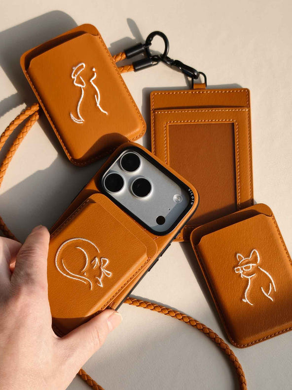 Product shot of toffee gold brown sicora vegan leather accessories: iPhone 18 / 17 pro case, magnetic card wallets, and ID badge holder with lanyard