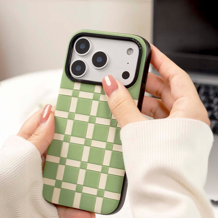 sicora vegan leather iPhone case with avocado green and white cream checkered pattern held by a person