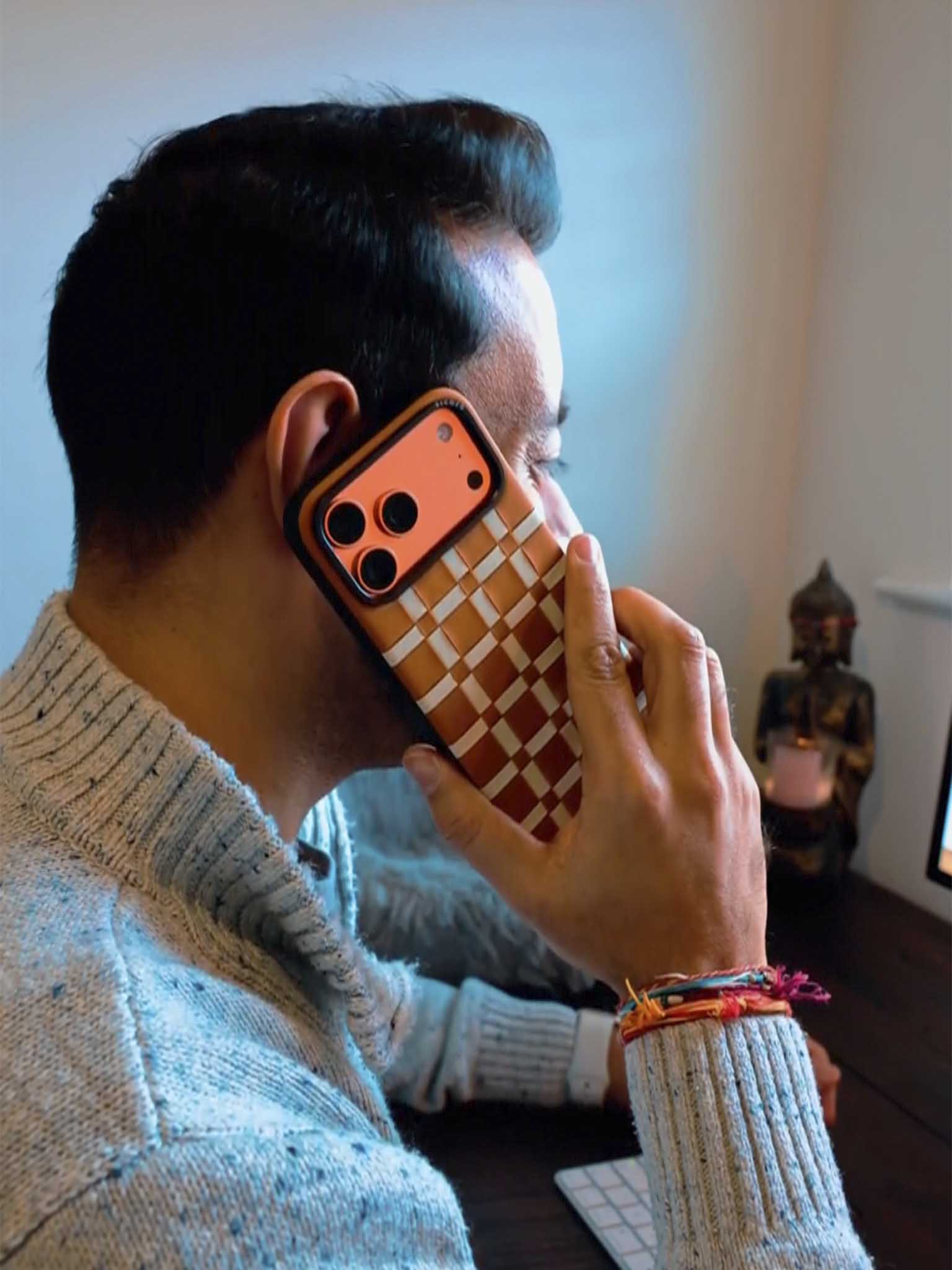 A KOL showcasing toffee brown sicora gridplay iPhone case