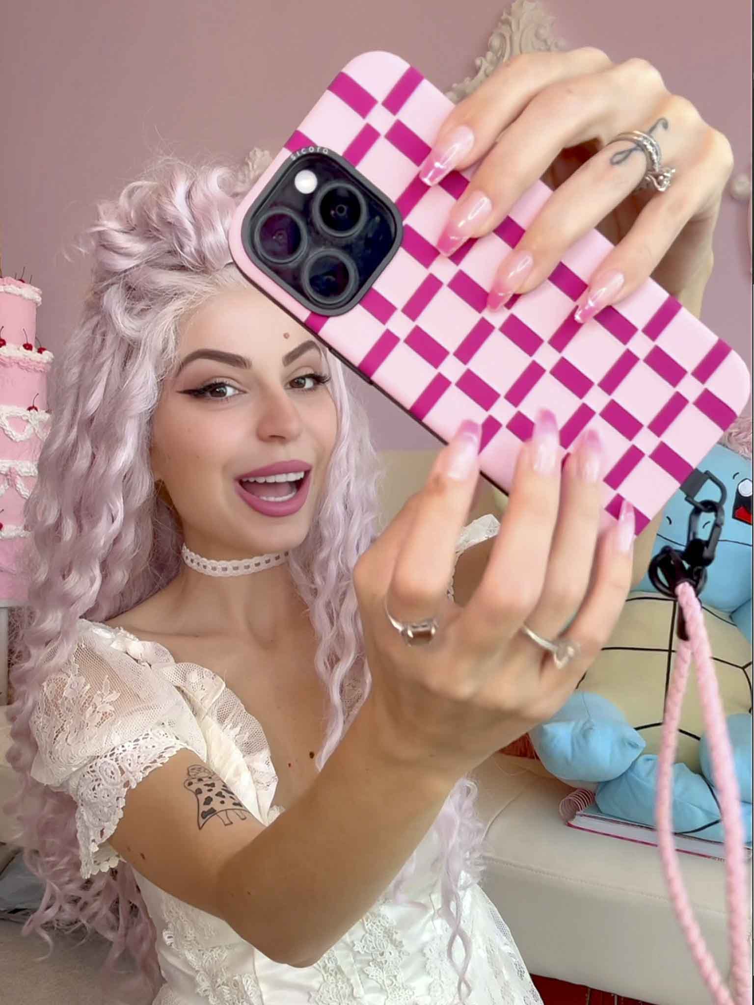 A KOL showcasing pink magenta sicora gridplay iPhone case with matching lanyard