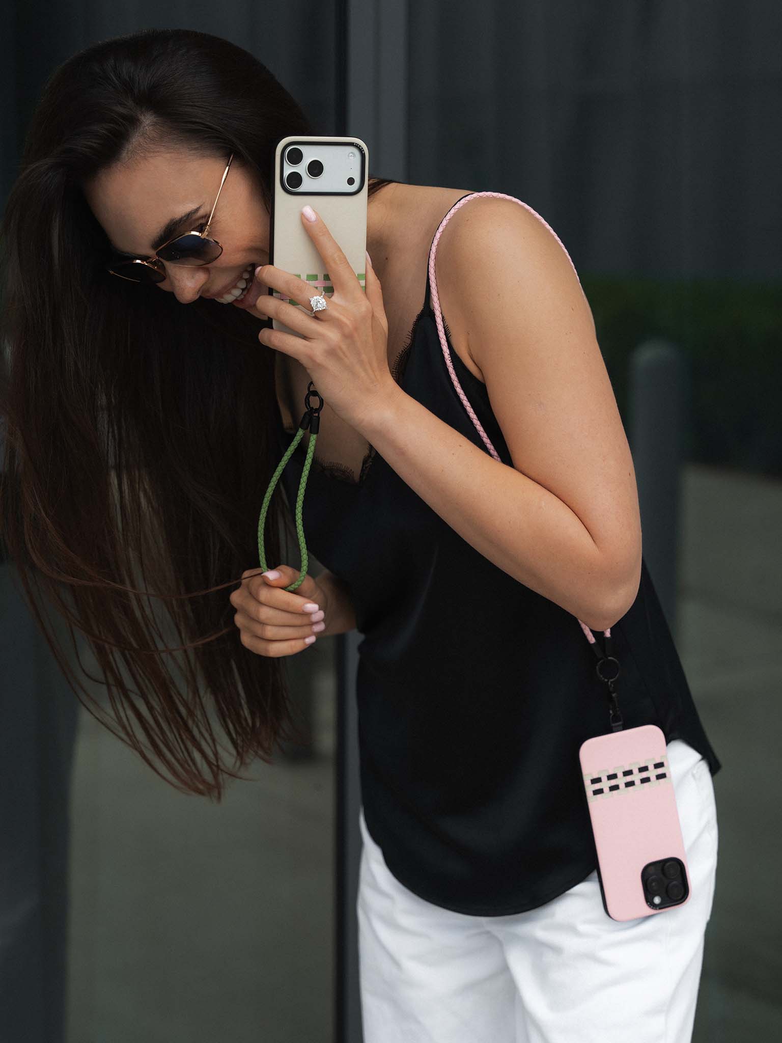 A KOL showcasing sicora stitchon iPhone cases and lanyards.