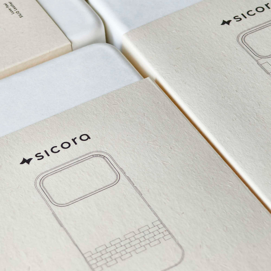 Close-up of a product packaging with 'sicora' branding on a white background