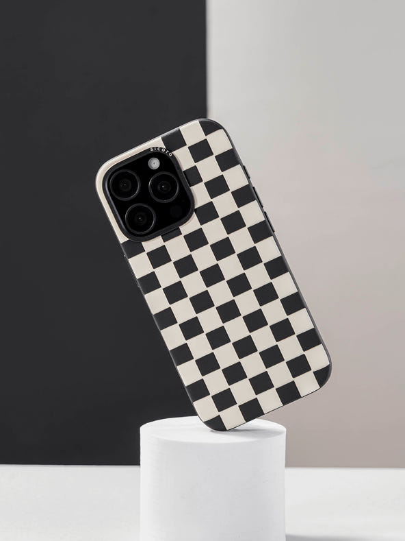 sicora black and white checkerboard iPhone case on a stand