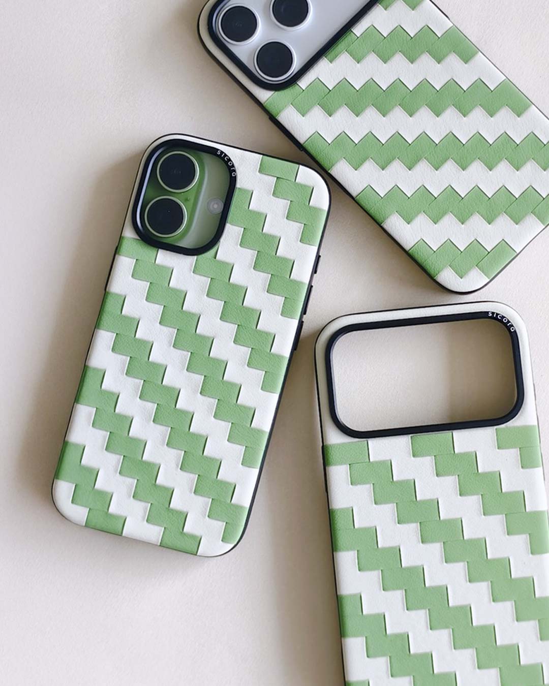 Green and white zigzag leather iphone cases 17, pro and pro max on a light background