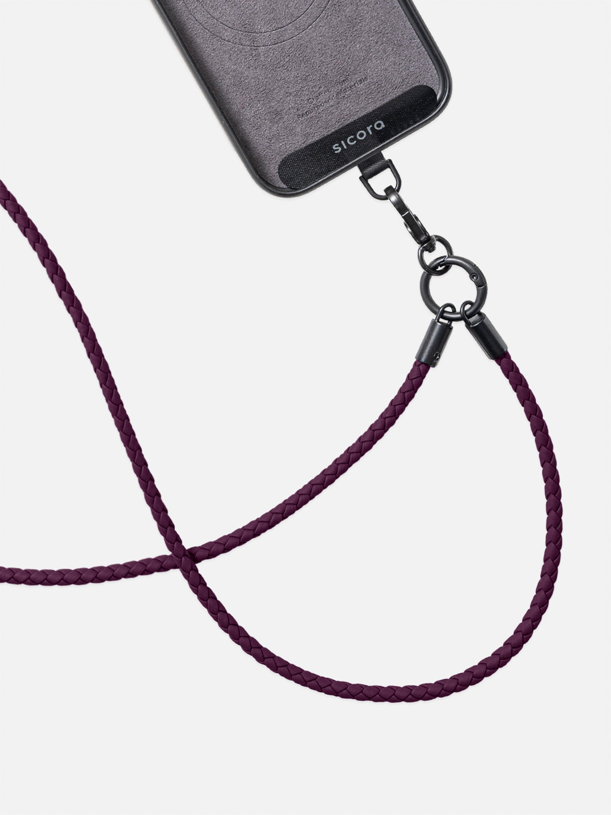 Close-up of a sicora dark cherry purple braided phone strap attached to a sicora iphone case with a black metal clasp.
