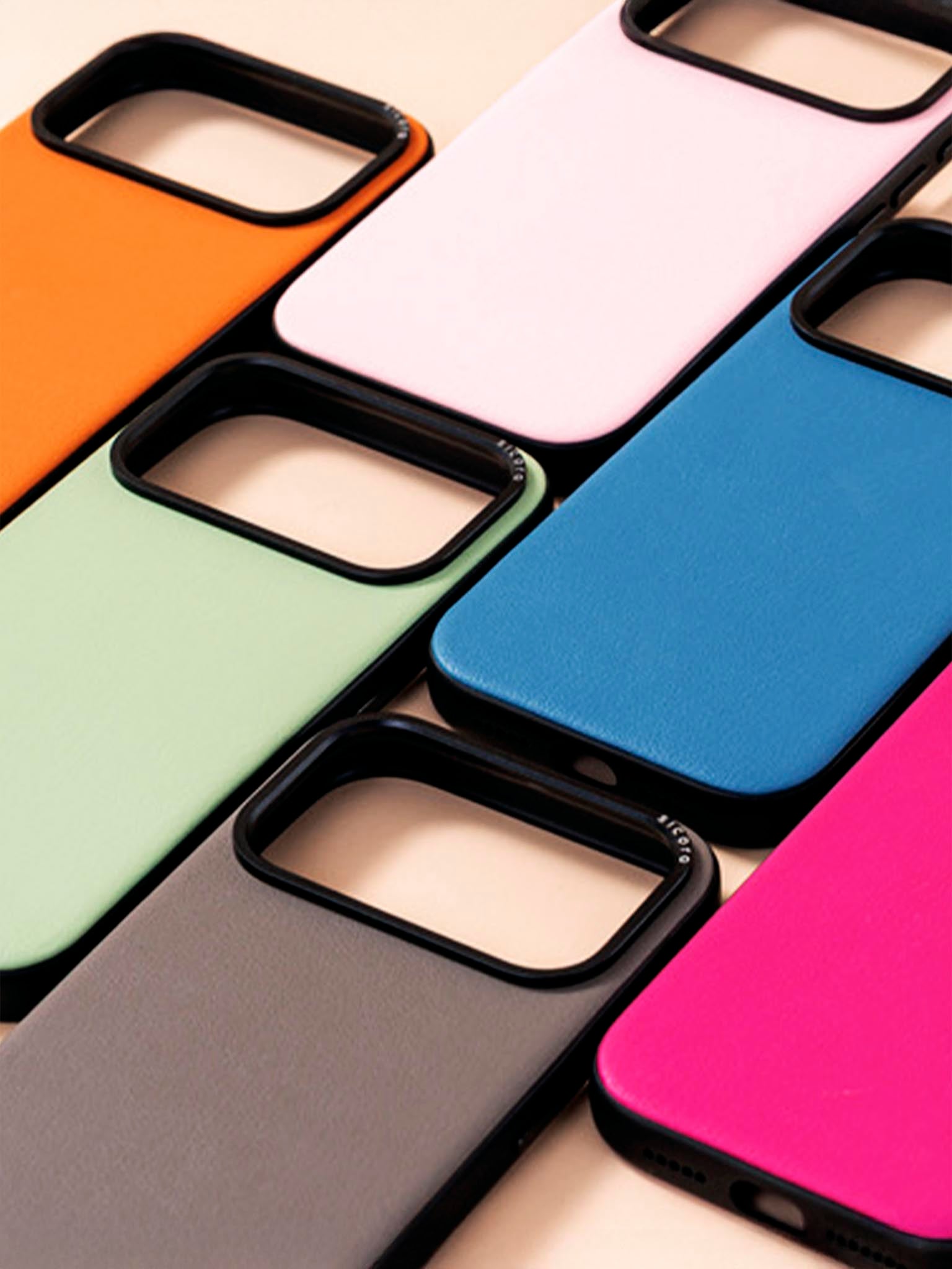 Collection of colorful sicora moodblock phone cases on a light background