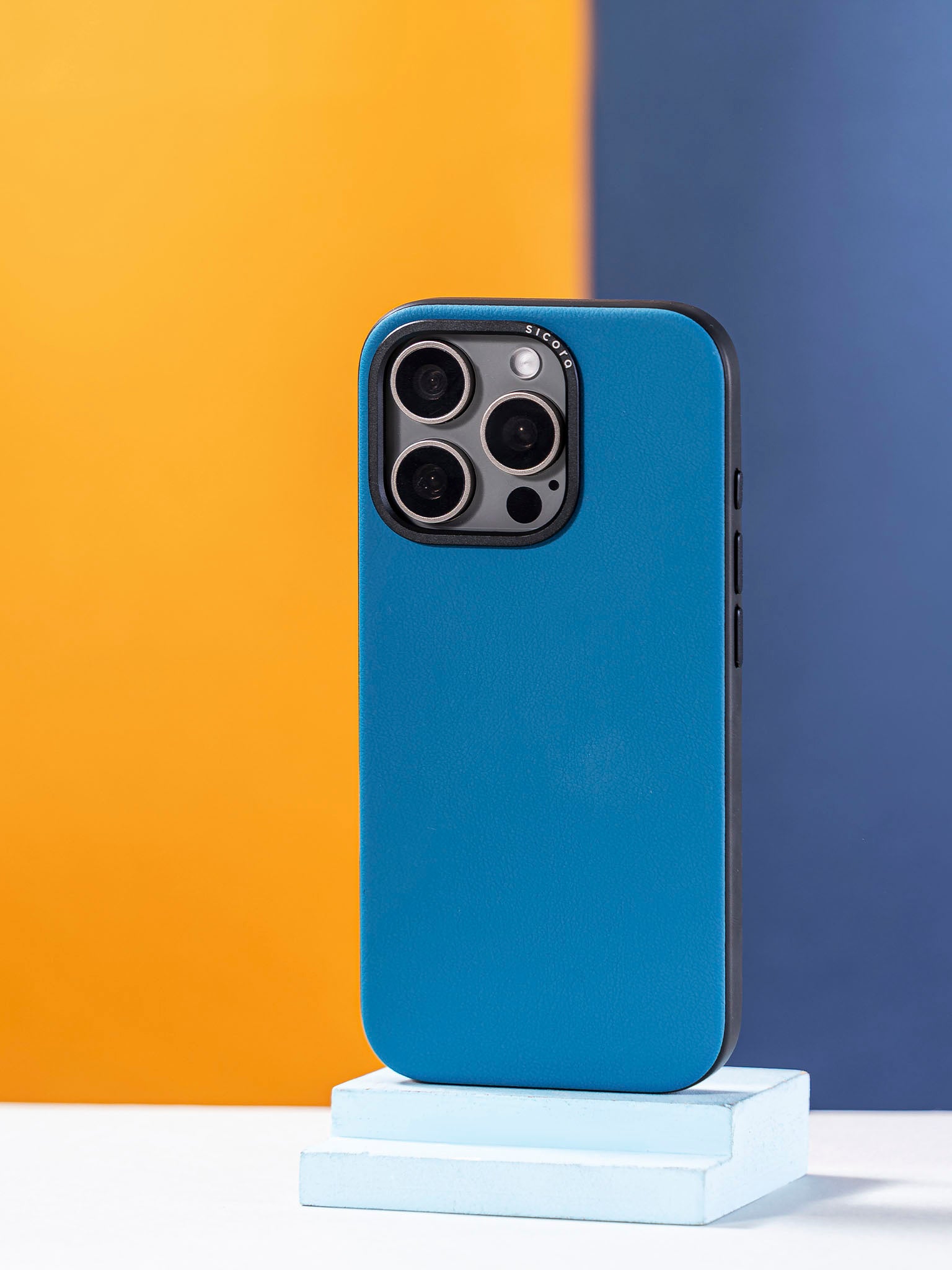 A blue sicora handmade vegan leather iPhone case