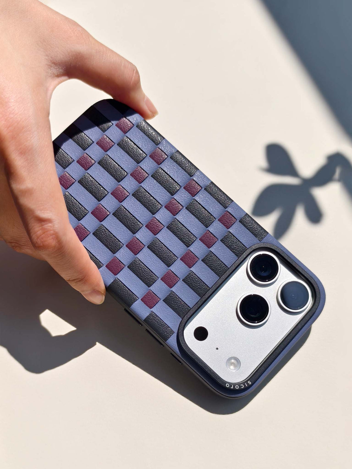 Product video showcasing sicora iPhone 18 pro vegan leather case, pixel case in shadow, black and cherry