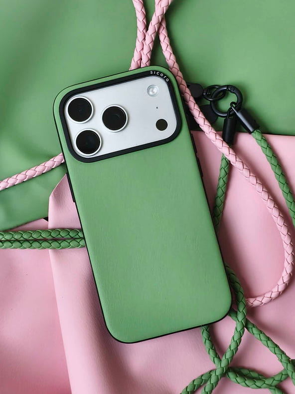 A green sicora moodblock iPhone 17 pro case with braided lanyards and black carabiner.