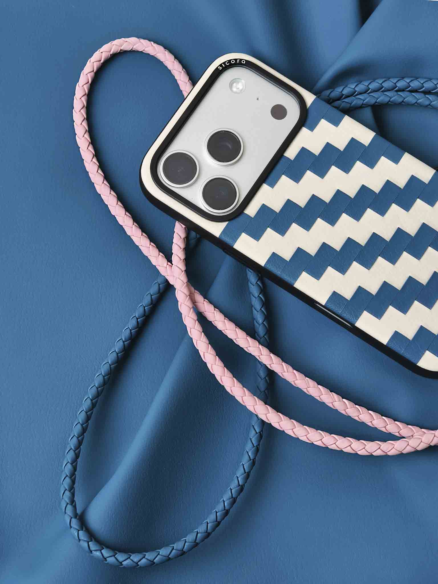 A blue sicora zigzag iPhone 17 pro case with braided lanyards.