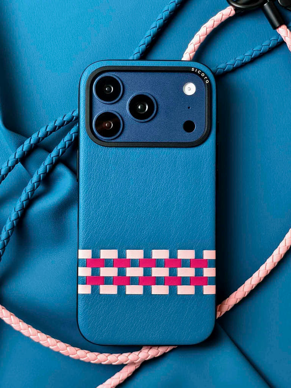 A blue sicora stitchon iPhone 17 pro case with braided lanyards.