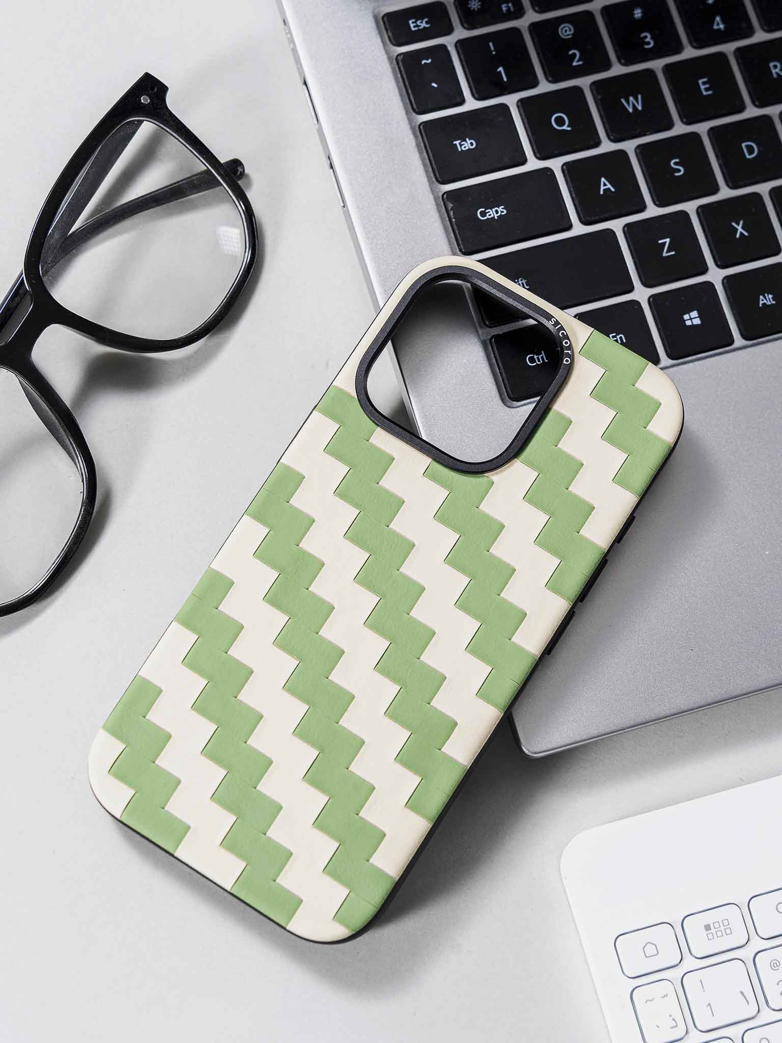 sicora green and white zigzag phone case on a desk