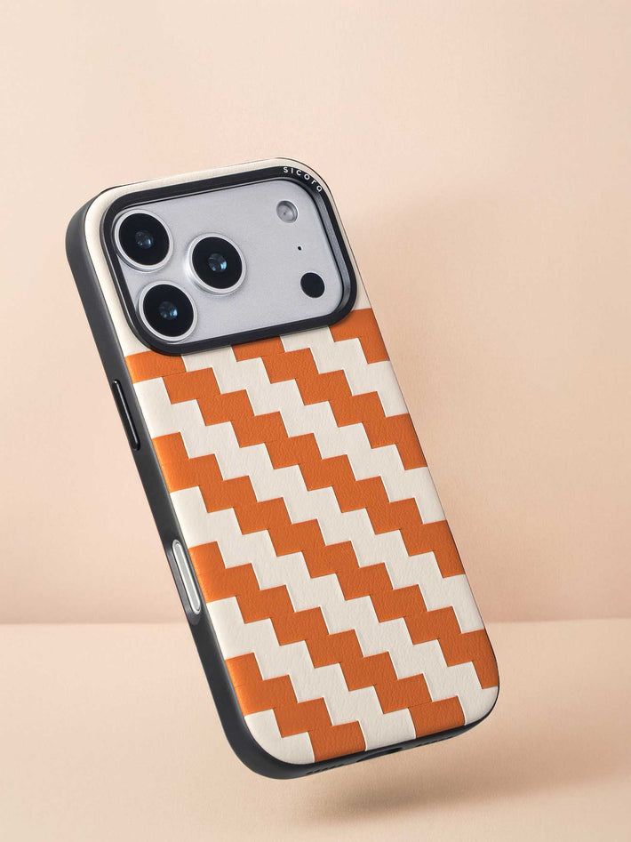 Sicora zigzag phone case with toffee gold and cream white zigzag pattern on a beige background