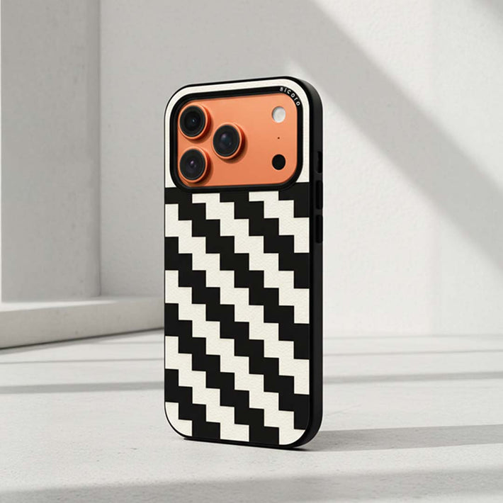 A sicora  iPhone case with black and white zigzag geometric pattern on a light gray surface